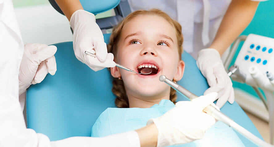 photo of a young girl at the dentist